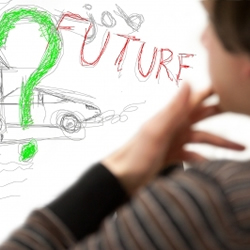 young boy looking at the word future next to a question mark